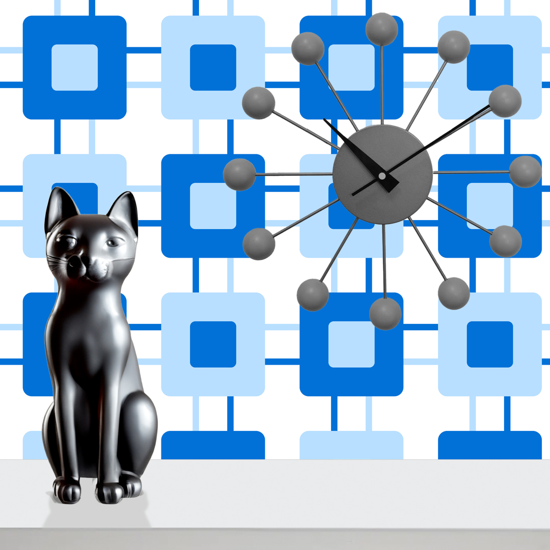 The artwork features a repeating geometric pattern of symmetrical shapes resembling elongated, curved diamonds or petals in various shades of blue and green. Each shape is split vertically with one half filled with a light blue and the other half filled with green or darker blue. The background is a light, almost pastel blue, which provides a soft yet vibrant backdrop. One of the blue shapes near the upper left contains a white starburst element, adding a focal point of brightness to the composition. The overall design conveys a modern, mid-century aesthetic with clean lines and harmonious color contrasts.